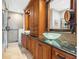 Luxurious bathroom featuring dual sinks, granite countertops, and a walk-in shower, creating a spa-like experience at 920 N Shore Ne Dr, St Petersburg, FL 33701