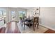 Cozy dining area with a sleek table set with seating for six and large windows at 920 N Shore Ne Dr, St Petersburg, FL 33701