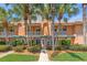 Charming townhome with lush landscaping, decorative balconies, and a welcoming walkway leading to the entrance at 920 N Shore Ne Dr, St Petersburg, FL 33701