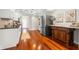 Charming kitchen features wood floors, stainless refrigerator, and decorative furniture at 920 N Shore Ne Dr, St Petersburg, FL 33701