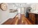 Charming kitchen features wood floors, stainless refrigerator, and decorative furniture at 920 N Shore Ne Dr, St Petersburg, FL 33701
