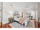 Comfortable main bedroom with hardwood floors, ceiling fan, and neutral decor, creating a serene retreat at 920 N Shore Ne Dr, St Petersburg, FL 33701
