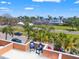 Inviting rooftop deck featuring chairs and a scenic view of the surrounding neighborhood and lush greenery at 920 N Shore Ne Dr, St Petersburg, FL 33701