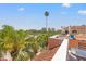 Relaxing rooftop patio with a table and chairs, perfect for enjoying the city views and sunny weather at 920 N Shore Ne Dr, St Petersburg, FL 33701