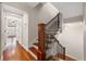 Elegant staircase with wooden steps and wrought iron railings, connecting the different levels of the home at 920 N Shore Ne Dr, St Petersburg, FL 33701