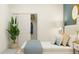 Inviting bedroom featuring a comfortable bed, stylish decor, and closet at 9308 Gladsome Dr, Land O Lakes, FL 34637