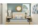 Inviting bedroom featuring a comfortable bed, stylish decor, and ample natural light at 9308 Gladsome Dr, Land O Lakes, FL 34637