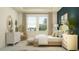 Comfortable main bedroom with ample natural light, stylish decor, and a cozy seating area at 9308 Gladsome Dr, Land O Lakes, FL 34637