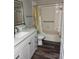 Bathroom showcasing a shower/tub combination with a white vanity at 9860 62Nd N Ter # 1036, St Petersburg, FL 33708