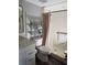 Well-organized bathroom with white tile shower and chrome storage shelves at 9860 62Nd N Ter # 1036, St Petersburg, FL 33708