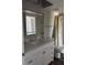 Bright bathroom featuring a white vanity and framed mirror at 9860 62Nd N Ter # 1036, St Petersburg, FL 33708