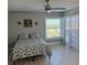 Bright bedroom with a ceiling fan and a view of the outdoors at 9860 62Nd N Ter # 1036, St Petersburg, FL 33708