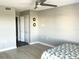 Open-concept bedroom showcasing a closet with sliding doors and a ceiling fan at 9860 62Nd N Ter # 1036, St Petersburg, FL 33708