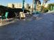 Outdoor seating area with tables, chairs and umbrellas at 9860 62Nd N Ter # 1036, St Petersburg, FL 33708