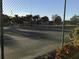 Well-maintained community tennis court surrounded by lush greenery and fencing at 9860 62Nd N Ter # 1036, St Petersburg, FL 33708