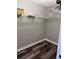 Spacious walk-in closet with hanging rods and wood look flooring at 9860 62Nd N Ter # 1036, St Petersburg, FL 33708