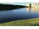 Scenic water view featuring a building reflecting in the calm water on a sunny day at 9860 62Nd N Ter # 1036, St Petersburg, FL 33708