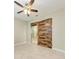 Bedroom featuring a decorative sliding barn door accent adding character to the room at 9917 Ivory Dr, Ruskin, FL 33573