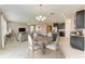 Open concept dining area with a view into the adjacent kitchen and living spaces at 9917 Ivory Dr, Ruskin, FL 33573
