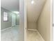 Hallway featuring a coat closet, tile floors and entry door, showing the floorplan layout at 9917 Ivory Dr, Ruskin, FL 33573