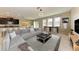 Open-concept living room showcasing a spacious seating area and modern decor that flows into the dining space at 9917 Ivory Dr, Ruskin, FL 33573