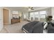 Relaxing main bedroom featuring neutral colors, bright windows, and a ceiling fan at 9917 Ivory Dr, Ruskin, FL 33573
