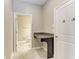 Convenient powder room featuring granite countertop, white cabinets, and easy access to the bathroom at 9917 Ivory Dr, Ruskin, FL 33573