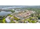 Aerial view showcasing the property near a lake and lush surroundings at 10034 64Th N Ave # 14, St Petersburg, FL 33708