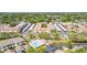 Community aerial view showing building, pool, parking, and surroundings at 10034 64Th N Ave # 14, St Petersburg, FL 33708