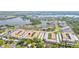 Aerial view of condo community nestled among lush trees and near water at 10034 64Th N Ave # 14, St Petersburg, FL 33708