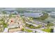 Aerial view of the condo community situated near a large lake at 10034 64Th N Ave # 14, St Petersburg, FL 33708