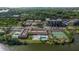 Community aerial featuring the pool, tennis courts, and ample parking at 10034 64Th N Ave # 14, St Petersburg, FL 33708