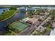 Community aerial featuring the pool, tennis courts, and lake views at 10034 64Th N Ave # 14, St Petersburg, FL 33708