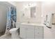Bathroom with a single vanity, a white cabinet, and a walk-in shower at 10034 64Th N Ave # 14, St Petersburg, FL 33708