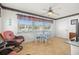 Dining area featuring a glass table and wicker chairs with views of the exterior at 10034 64Th N Ave # 14, St Petersburg, FL 33708