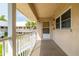 Condo patio, a cozy outdoor living space overlooking greenery and palms at 10034 64Th N Ave # 14, St Petersburg, FL 33708