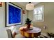 Cozy dining area features a wood table, two chairs, and a large window for natural light at 1006 E River Cove St, Tampa, FL 33604