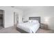Light and airy bedroom boasts neutral tones and a calming, comfortable ambiance at 10914 Penny Gale Loop, San Antonio, FL 33576