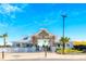 The community clubhouse welcomes you with a bright entrance, white trim, and coastal landscaping at 10914 Penny Gale Loop, San Antonio, FL 33576