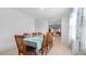 Bright dining room with tile floors and large table with seating for eight at 10914 Penny Gale Loop, San Antonio, FL 33576