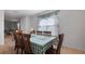 Bright dining room with tile floors and a large table with seating for six at 10914 Penny Gale Loop, San Antonio, FL 33576