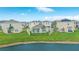 Beautiful single-Gathering homes are seen from a lake view, boasting a serene setting in a well-planned community at 10914 Penny Gale Loop, San Antonio, FL 33576