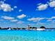 Enjoy a fun day at the community lagoon, featuring inflatable slides, climbing structures, and clear blue water at 10914 Penny Gale Loop, San Antonio, FL 33576