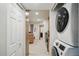 Hallway featuring a stacked washer and dryer at 1122 Bowsprit Ln # 1107, Holiday, FL 34691