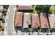 An aerial view of neighborhood homes featuring tile roofs, neat landscaping, and community streets at 120 Moscata Way, Nokomis, FL 34275