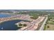 Stunning aerial view showcasing a lakeside community with lush landscaping, and scenic waterfront at 120 Moscata Way, Nokomis, FL 34275