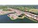 Breathtaking aerial view of the community, highlighting the waterfront homes and tranquil lake at 120 Moscata Way, Nokomis, FL 34275