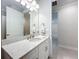 Bathroom featuring granite countertop and a large mirror above the vanity at 120 Moscata Way, Nokomis, FL 34275