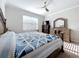 Comfortable bedroom with large bed, wood furniture and lots of natural light at 120 Moscata Way, Nokomis, FL 34275