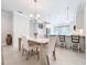 Bright dining area with modern chandelier and breakfast bar at 120 Moscata Way, Nokomis, FL 34275